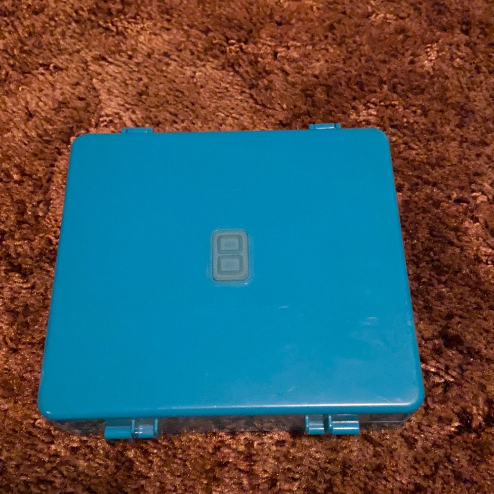 Nintendo DS Gameboy and game holder